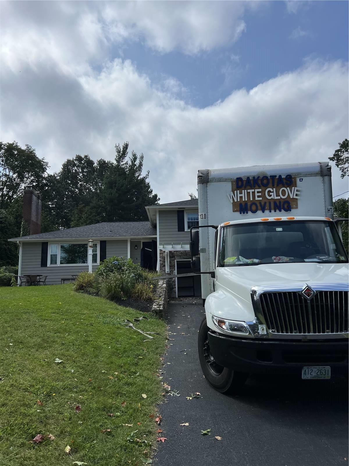 Dakota's Moving Service truck arriving at a customer home in New Hampshire