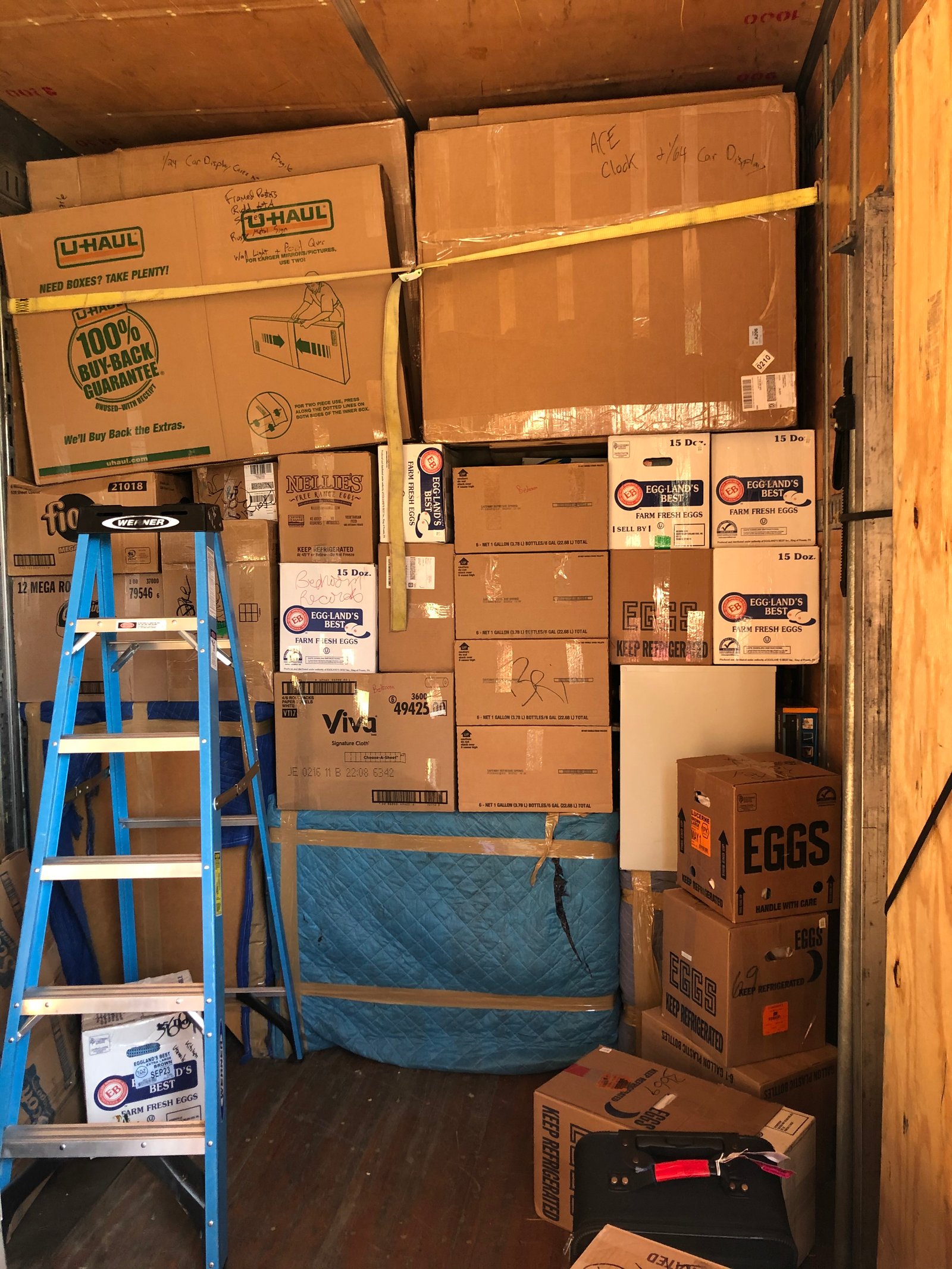 Packed moving truck with boxes and supplies organized before moving day